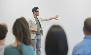 man giving a talk in front of an audience