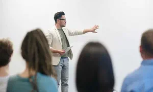 man giving a talk in front of an audience