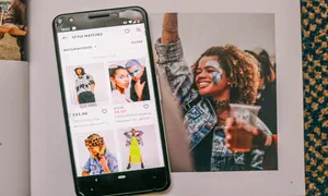 photo of smartphone with screen showing a clothes retail app