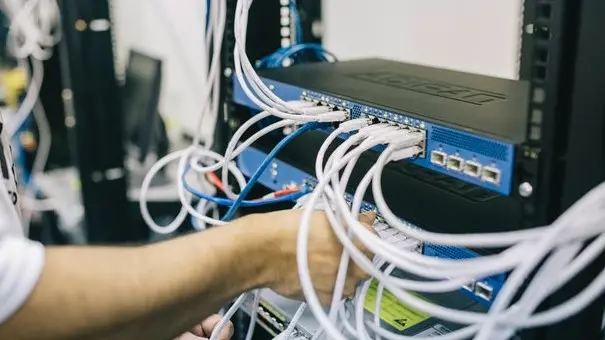Person handling cables in a data server