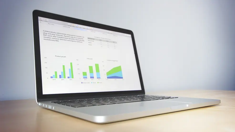 Laptop with analytics charts on screen