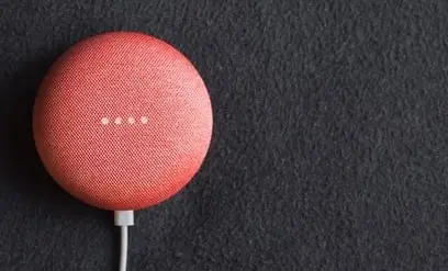 Red smart speaker on a surface