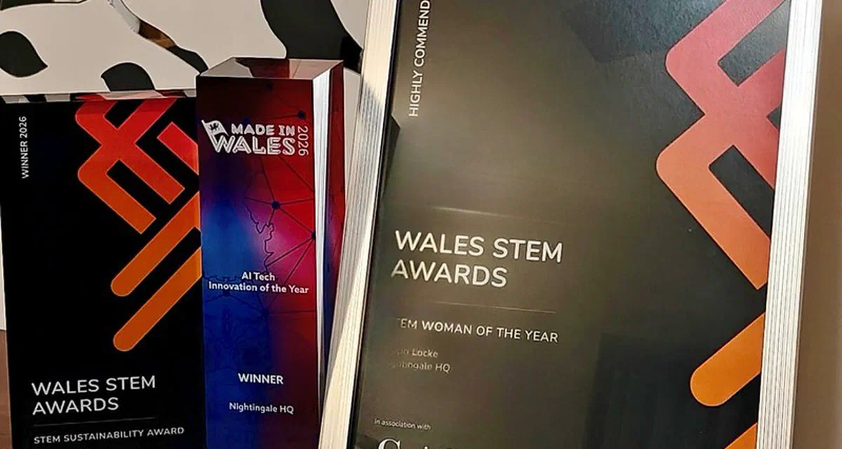 Nightingale HQ's three 2026 awards displayed together on a wooden shelf: the black Wales STEM Awards Sustainability Award winner plaque, the Made in Wales 2026 AI Tech Innovation of the Year winner trophy, and a silver-framed Wales STEM Awards Highly Commended certificate for STEM Woman of the Year awarded to Steph Locke.