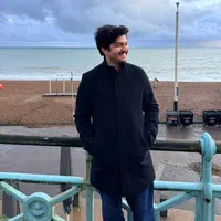A photo of Muhammad Saad standing by the seafront in Brighton