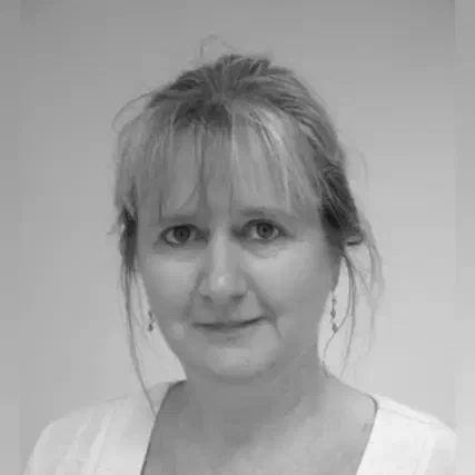 Wendy Owen, a woman with shoulder-length fair hair and a fringe, in a black and white portrait